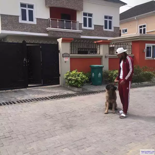 Photo: Flavour Strolls With His Dog In Front Of His House